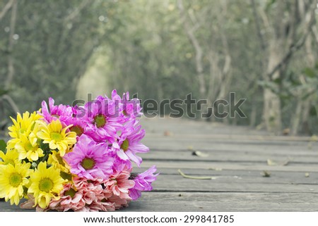 Flowers laying on the wood floor