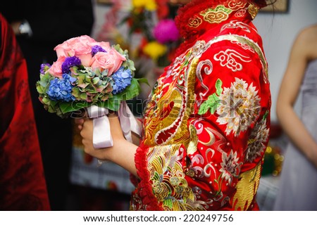 Chinese Wedding, Traditional Dress of Bride with Wedding Bouquet