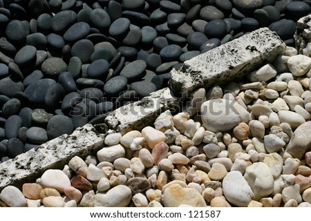 Black and white stones trim a zen rock garden.