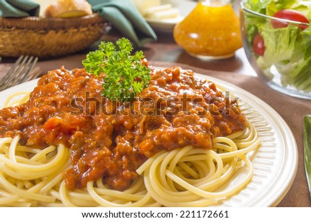 spaghetti with meat sauce and salad \