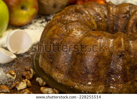 freshly baked apple coconut cake with walnuts in a bundt style 