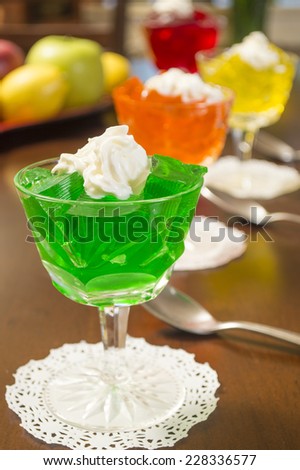 colorful gelatin desserts lined up on a table ready to enjoy \