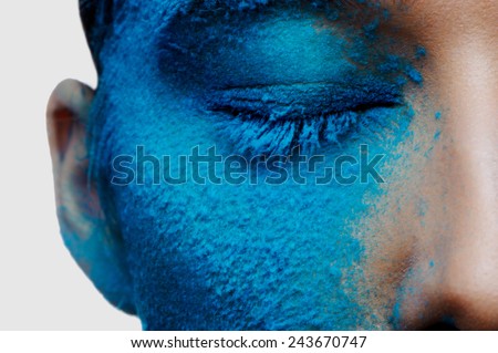 Half beauty face with blue makeup