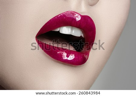 Beauty macro Makeup with white Skin, pink Lips and white Teeth.