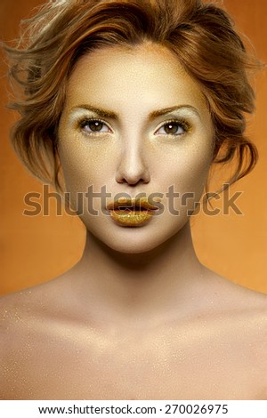 Golden Makeup on pretty Face of fashion beauty Female Model