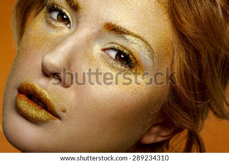 Fashion beauty glamour Blonde Model with gold Face and Lips