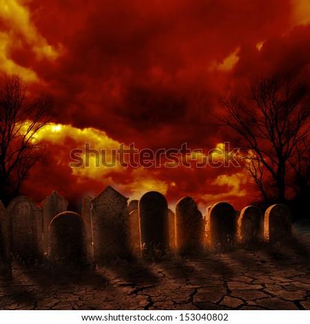 Spooky graveyard with burning sky