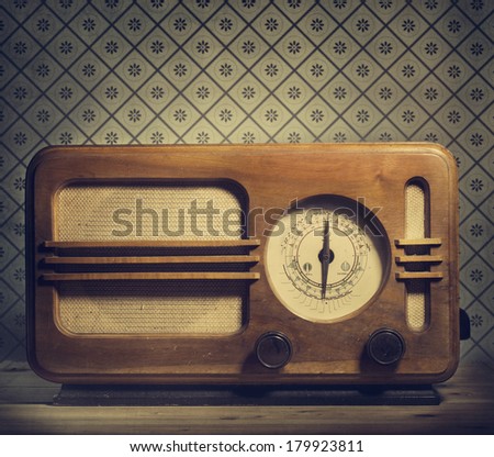 Antique radio on retro background