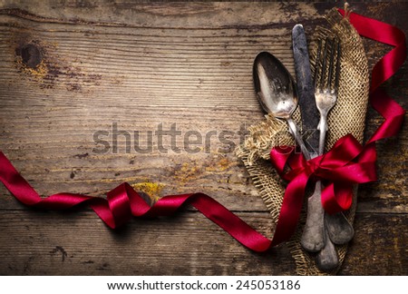 Vintage silverware decorated with red ribbon