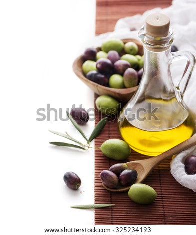 Olive oil bottle and olive fruit with copyspace