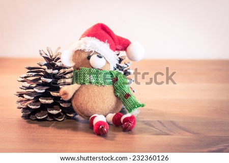 Sweet Christmas Bear sit near a pine cones/Christmas Bear and pine cones