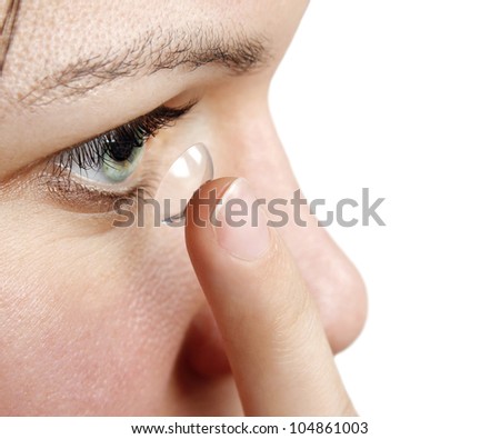 Woman inserting a contact lens