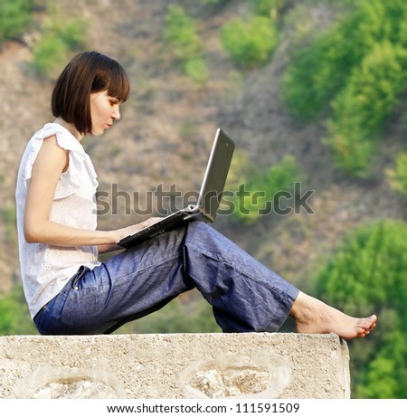 Young woman student learning in the nature