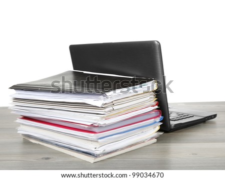 Many files and a computer on a desk isolated on white background