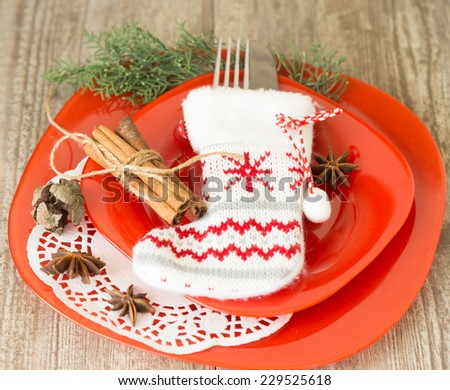 Christmas dinner invitation on wooden background