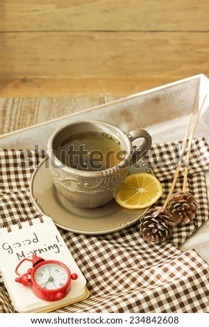 Tea time, cup of tea with lemon and Good morning note