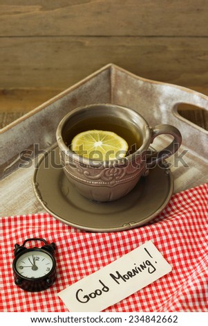 Tea time, cup of tea with lemon and Good morning note