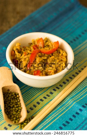 Healthy dinner, indian beans and rice with vegetables on the wooden table