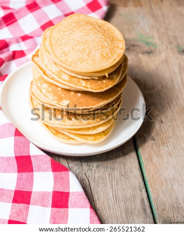 Fried pancakes on old wooden table. Top view