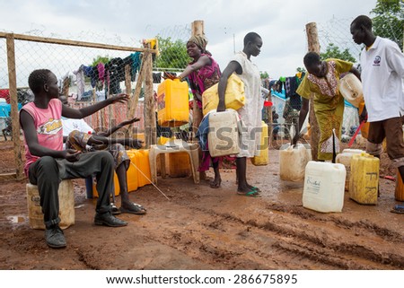 Juba, South Sudan - April 10, 2014: South Sudanese refugees get the daily ration of water