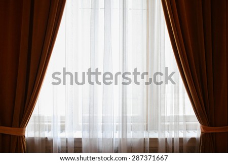 Color picture of curtains framing a window