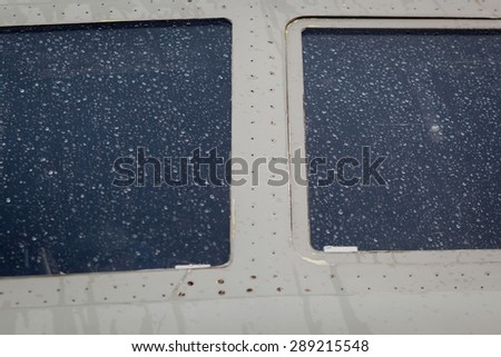 Color picture of rain drops on an airplane window