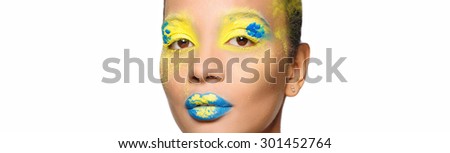 Isolated portrait of a young black woman beautiful girl with bright colored makeup on a white background