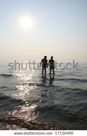 stock photo : Two people holding hands at the beach