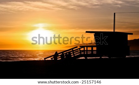 california sunset with life guard station silhouette