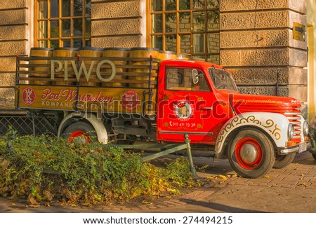KRAKOW, POLAND - NOV 04, 2014: Truck with beer barrels to attract tourists to the restaurant.  Picture taken while traveling in Poland.