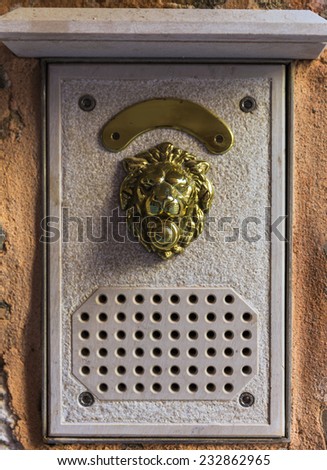 intercom system, the image of a lion from the yellow metal