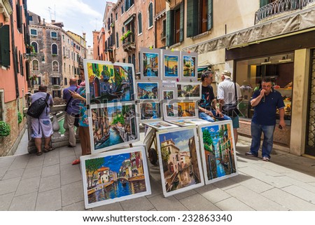 ITALY, VENICE - JUNE 26, 2014: Local artists and vendors, offer tourists a picture with the scenery of Venice, Writing oil.