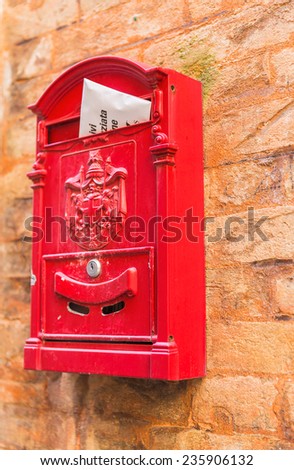 Red mail box on the wall