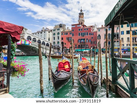 VENICE, ITALY - June 26, 2014: Tourists travel on gondolas in Venice, Italy. Gondola ride is the most popular tourist activities in Venice.