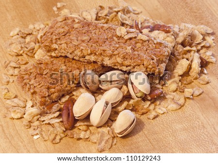 two granola bars with grains pecans and pistachios
