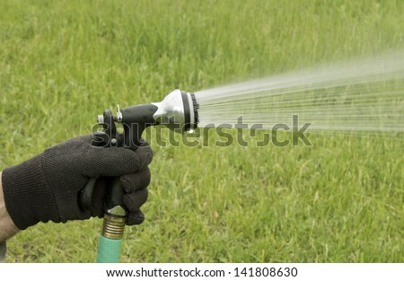 large  hose nozzle used in the garden for irrigation