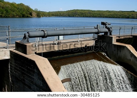 control mechanism for opening and closing the dam gates