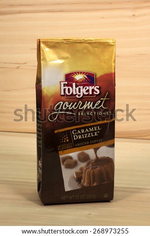 RIVER FALLS,WISCONSIN-APRIL 12,2015: A package of Folgers Caramel Drizzle gourmet coffee. Folgers is a product of J.M.Smucker Company.