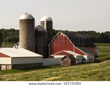 RIVER FALLS,WISCONSIN-JUNE 12,2015: A well kept barn and other structures on a small farm.