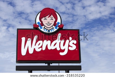 RIVER FALLS,WISCONSIN-SEPTEMBER20,2015: Advertising sign for Wendy\'s restaurant chain. Wendy\'s was founded by Dave Thomas in Nineteen Sixty Nine.