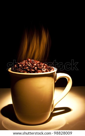 ceramic cup filled with smoking hot coffee beans