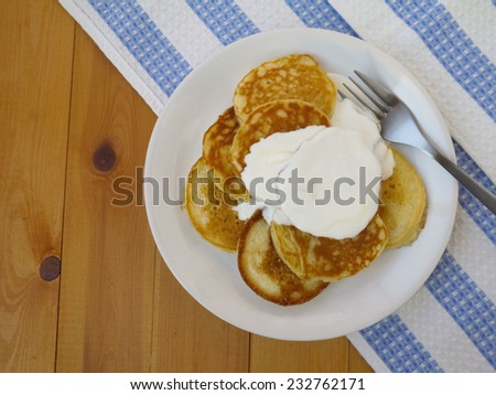 Pancakes with sour cream top view