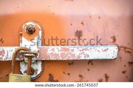 Texture and background of the old lock with rusty on iron box