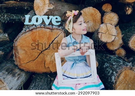 nice little model posing on a background of wooden beams