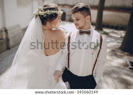lovely wedding couple oditi a crown of butterflies and suspenders