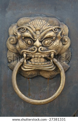 Photo of a Chinese Door With Door Knocker,This is on a city front door knocker.