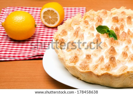 Lemon meringue pie on white plate