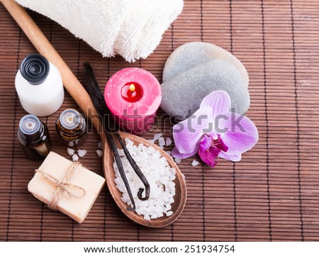 Spa still life with hand made soap, candle, sea salt and vanilla pods