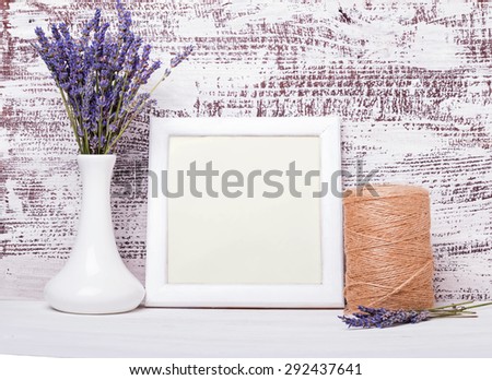 White empty frame with place for text and lavender flowers. Mock up.