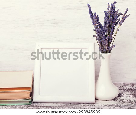 White empty frame with place for text and lavender flowers. Mock up.